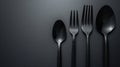 Three forks and a spoon on a black background Royalty Free Stock Photo