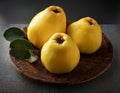 Arrangement of three fresh yellow quinces
