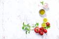 An arrangement of tomatoes, basil, olive oil and himalayan salt Royalty Free Stock Photo