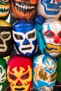 Arrangement of various luchador masks as a background