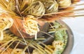 Arrangement of various types of pasta on display against a white background