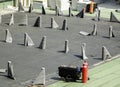 Arrangement of waterproofing membranes rolls on a construction site