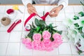 Arranging artificial flowers decoration at home, Young woman florist work making organizing diy artificial flower, craft and hand