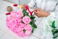 Arranging artificial flowers decoration at home, Young woman florist work making organizing diy artificial flower, craft and hand