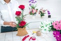 Arranging artificial flowers decoration at home, Young woman florist work making organizing diy artificial flower, craft and hand