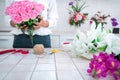 Arranging artificial flowers decoration at home, Young woman florist work making organizing diy artificial flower, craft and hand