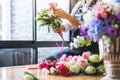 Arranging artificial flowers vest decoration at home, Young woman florist work making organizing diy artificial flower, craft and Royalty Free Stock Photo