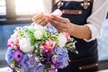 Arranging artificial flowers vest decoration at home, Young woman florist work making organizing diy artificial flower, craft and Royalty Free Stock Photo