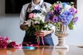 Arranging artificial flowers vest decoration at home, Young woman florist work making organizing diy artificial flower, craft and