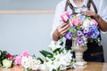 Arranging artificial flowers vest decoration at home, Young woman florist work making organizing diy artificial flower, craft and