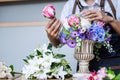 Arranging artificial flowers vest decoration at home, Young woman florist work making organizing diy artificial flower, craft and