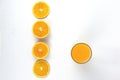 Arranging of pieces juicy oranges with glass of orange isolated on white background, top view concept style