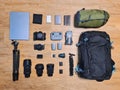 Arranging professional photographer equipment with camera, lens, backpack, laptop, case, filter, tripod, drone and sleeping bag on Royalty Free Stock Photo