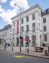 People sit and walk in front of theatre in french city of Arras