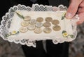 Arras, pesetas, old Spanish coins on a tray that are used in the religious celebration of marriage in Spain.