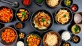 Assorted asian cuisine bowls: noodles, vegetables, and sauces Royalty Free Stock Photo