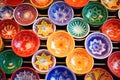 array of brightly painted ceramic plates