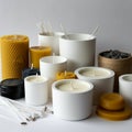 Array of candles in white and black containers, featuring both smooth and Royalty Free Stock Photo