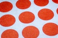 Array close-up of blank red circural multi purpose dot labels isolated on white background