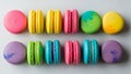 An array of colorful macarons arranged in two rows against a light Royalty Free Stock Photo
