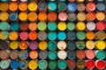 Array of colorful paint cans viewed from above in an art supply store. The image is generated with the use of an AI.