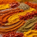 An array of colorful spices is arranged on a flat surface. The spices include vibrant Royalty Free Stock Photo