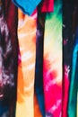 Array of colorful unisex tie-dye shirts Royalty Free Stock Photo