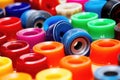 an array of different colored skateboard wheels on a clean surface