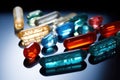 array of different-shaped immunomodulator pills on glass slide Royalty Free Stock Photo