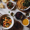 an array of dishes with fruits and a side of bread