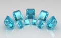 Array of emerald cut blue aquamarine stones