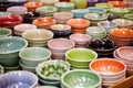 array of finished glazed porcelain dishes on a countertop
