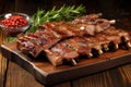 array of glazed pork ribs on a rustic wooden table