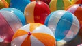 An array of inflatable beach balls in various sizes and colors each displaying their unique plastic textures under the