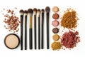 An array of makeup brushes, palettes, and powders is neatly displayed on a white surface, inviting creativity in beauty Royalty Free Stock Photo