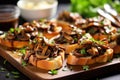 an array of mushroom bruschetta in a stylish serving platter