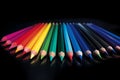 An array of neon-bright colored pencils on a black background (Generative AI)