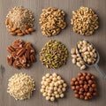 An array of nine different types of nuts is displayed on a wooden surface Royalty Free Stock Photo