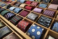Array of retailer ties on display in square compartments Royalty Free Stock Photo