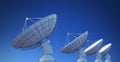 Array of satellite dishes or radio antennas against blue sky. 3D rendered illustration
