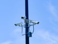 Array of security cameras in a parking lot. Royalty Free Stock Photo