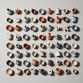 An array of 63 small ceramic vessels is arranged on a flat surface in rows Royalty Free Stock Photo