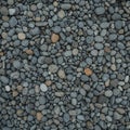 An array of smooth, weathered pebbles in various shades of gray and brown, densely Royalty Free Stock Photo
