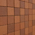 Array of textured square terracotta tiles angled slightly Royalty Free Stock Photo