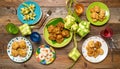 An array of traditional Indonesian Eid al-Fitr dishes is elegantly arranged on a wooden table. Royalty Free Stock Photo