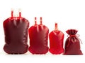 Array of various sized blood bags on white background Royalty Free Stock Photo