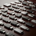 An array of various USB flash drives arranged neatly on a wooden Royalty Free Stock Photo