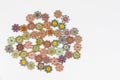 Array of vibrant colored ornamental buttons artfully arranged against a white background Royalty Free Stock Photo