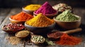 An Array of Vibrant Spices in Wooden Bowls and Spoons on Wood Royalty Free Stock Photo