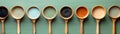 Array of Wooden Spoons on Green Background, Kitchen Utensils for Cooking and Baking Concept, Top View